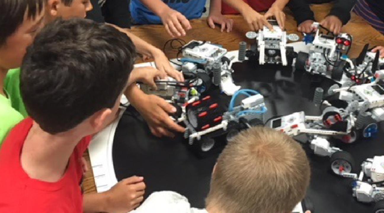 Children operating lego robotics